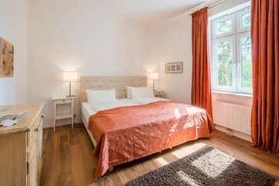 Ein Bett oder Betten in einem Zimmer der Unterkunft Seebadvilla