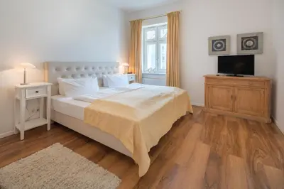 Ein Bett oder Betten in einem Zimmer der Unterkunft Seebadvilla