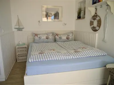 Ein Bett oder Betten in einem Zimmer der Unterkunft Strandperle 3