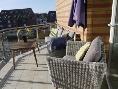 Ein Sitzbereich in der Unterkunft Strandperle 3