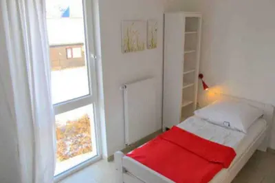 Ein Bett oder Betten in einem Zimmer der Unterkunft Apartmentvermittlung Mehr als Meer - Objekte 42 & 51