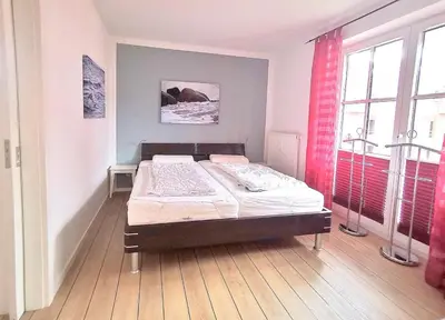 Ein Bett oder Betten in einem Zimmer der Unterkunft Apartmentvermittlung Mehr als Meer - Objekt 60