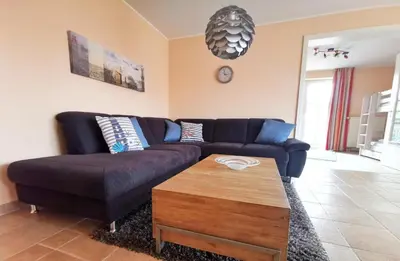 Ein Sitzbereich in der Unterkunft Apartmentvermittlung Mehr als Meer - Objekt 20