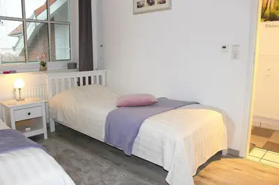 Ein Bett oder Betten in einem Zimmer der Unterkunft Apartmentvermittlung Mehr als Meer - Objekt 15