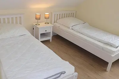 Ein Bett oder Betten in einem Zimmer der Unterkunft Apartmentvermittlung Mehr als Meer - Objekt 24