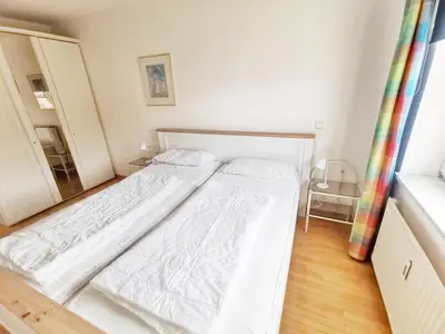 Ein Bett oder Betten in einem Zimmer der Unterkunft Apartmentvermittlung Mehr als Meer - Objekt 16