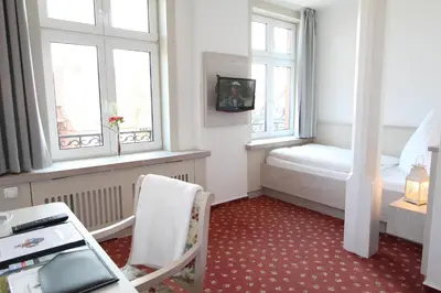 Ein Bett oder Betten in einem Zimmer der Unterkunft Hotel Thormählen