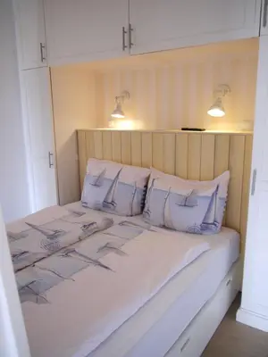 Ein Bett oder Betten in einem Zimmer der Unterkunft Strandperle 4