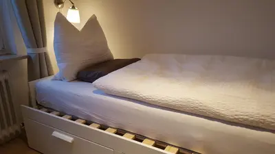 Ein Bett oder Betten in einem Zimmer der Unterkunft FeWo Machedanz zentrumsnah & ruhig Timmendorfer Strand