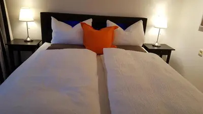 Ein Bett oder Betten in einem Zimmer der Unterkunft FeWo Machedanz zentrumsnah & ruhig Timmendorfer Strand
