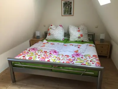 Ein Bett oder Betten in einem Zimmer der Unterkunft Lübecker Ganghausperle Smart