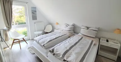 Ein Bett oder Betten in einem Zimmer der Unterkunft FeWo Machedanz am Hafen Timmendorfer Strand OT Niendorf