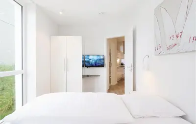 Ein Bett oder Betten in einem Zimmer der Unterkunft Priwallpromenade 2, Whg 1