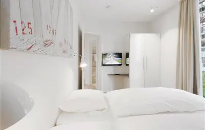 Ein Bett oder Betten in einem Zimmer der Unterkunft Priwallpromenade 3, Whg 4