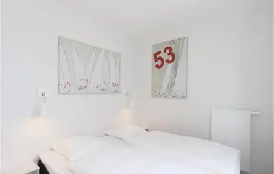 Ein Bett oder Betten in einem Zimmer der Unterkunft Priwallpromenade 23, Whg 1