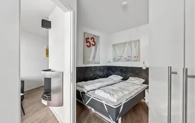 Ein Bett oder Betten in einem Zimmer der Unterkunft Priwallpromenade 23, Whg 2