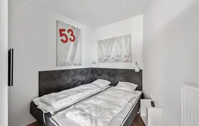 Ein Bett oder Betten in einem Zimmer der Unterkunft Priwallpromenade 23, Whg 2