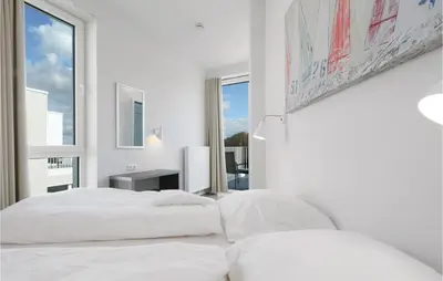 Ein Bett oder Betten in einem Zimmer der Unterkunft Priwallpromenade 23, Whg 11