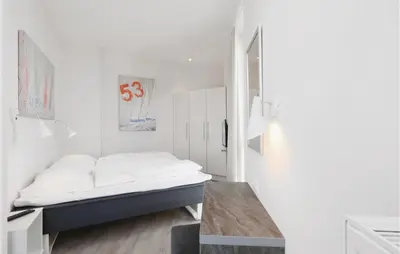 Ein Bett oder Betten in einem Zimmer der Unterkunft Priwallpromenade 23, Whg 11