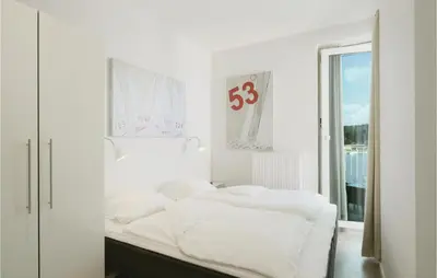 Ein Bett oder Betten in einem Zimmer der Unterkunft Priwallpromenade 31, Whg 26