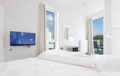 Ein Bett oder Betten in einem Zimmer der Unterkunft Priwallpromenade 31, Whg 27