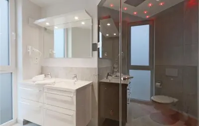 Ein Badezimmer in der Unterkunft Dünenvilla 1, Whg 3