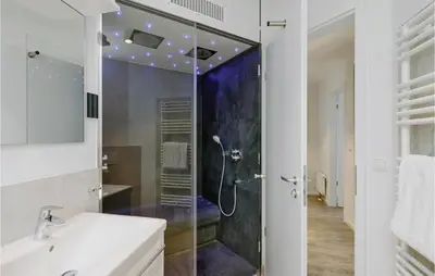 Ein Badezimmer in der Unterkunft Dünenvilla 2, Whg 3