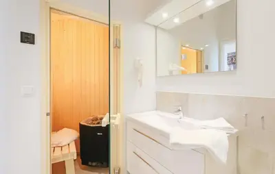 Ein Badezimmer in der Unterkunft Dünenvilla 2, Whg 5