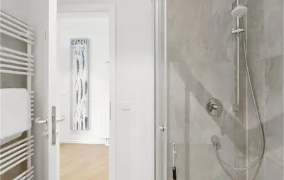 Ein Badezimmer in der Unterkunft Dünenvilla 17, Whg 6