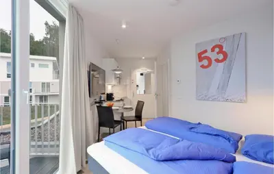 Ein Bett oder Betten in einem Zimmer der Unterkunft Dünenvilla 17, Whg 8