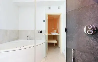 Ein Badezimmer in der Unterkunft Dünenvilla 17, Whg 10