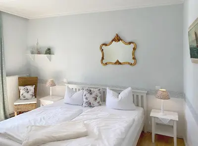 Ein Bett oder Betten in einem Zimmer der Unterkunft Villa Hansa am Meer