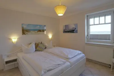 Ein Bett oder Betten in einem Zimmer der Unterkunft Strandhaus Brunhild
