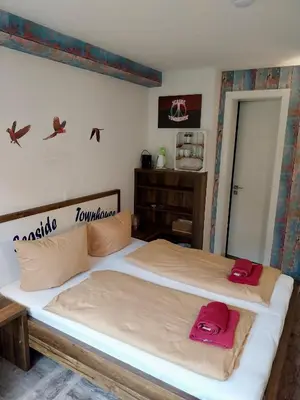 Ein Bett oder Betten in einem Zimmer der Unterkunft Seaside-Townhouse