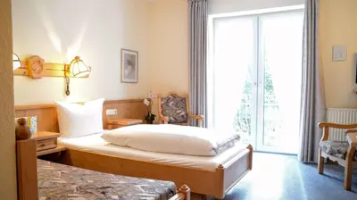 Ein Bett oder Betten in einem Zimmer der Unterkunft Waldhotel Twiehaus Garni