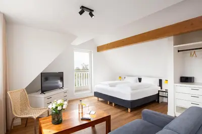 Ein Bett oder Betten in einem Zimmer der Unterkunft Hotel Meerzeit
