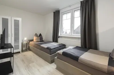 Ein Bett oder Betten in einem Zimmer der Unterkunft Arkadia Apartments-Schwissel-Bad Segeberg