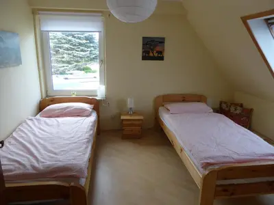 Ein Bett oder Betten in einem Zimmer der Unterkunft Ostseeferienwohnung Storchennest