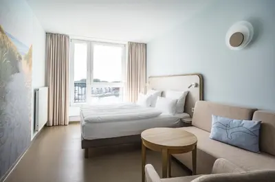 Ein Bett oder Betten in einem Zimmer der Unterkunft aja Travemünde