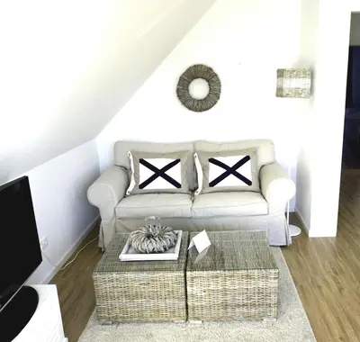Ein Sitzbereich in der Unterkunft Ferienwohnung Koje 44