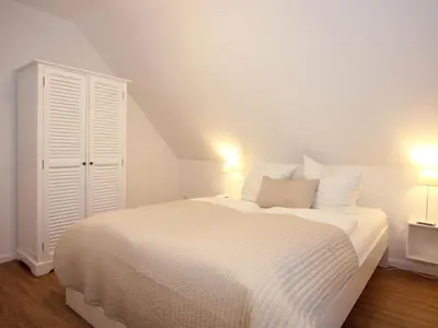 Ein Bett oder Betten in einem Zimmer der Unterkunft Ferienwohnung Koje 44