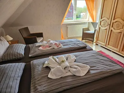 Ein Bett oder Betten in einem Zimmer der Unterkunft Ferienwohnung Haus Rita