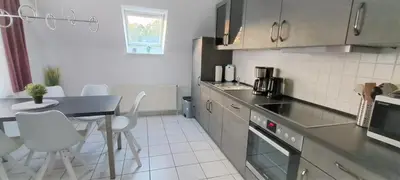 Küche/Küchenzeile in der Unterkunft Haus Südstrand 09, Panoramameerblick