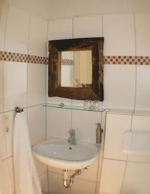 Ein Badezimmer in der Unterkunft Hotel Farchauer Mühle