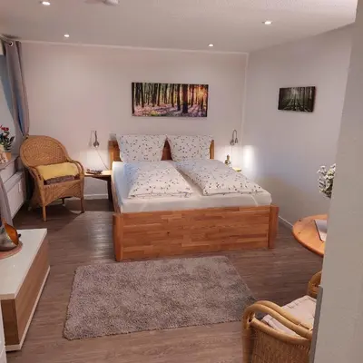 Ein Bett oder Betten in einem Zimmer der Unterkunft Gästehaus Langhals