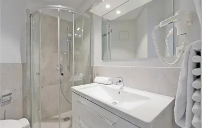 Ein Badezimmer in der Unterkunft Dünenvilla 19, Whg 4