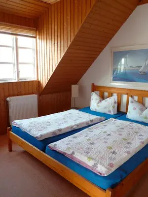 Ein Bett oder Betten in einem Zimmer der Unterkunft Landhaus-Marwede App 5