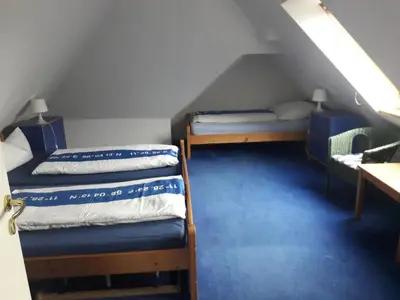 Ein Bett oder Betten in einem Zimmer der Unterkunft Landhaus-Marwede App 5