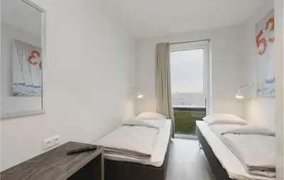 Ein Bett oder Betten in einem Zimmer der Unterkunft Priwallpromenade 1, Whg 3