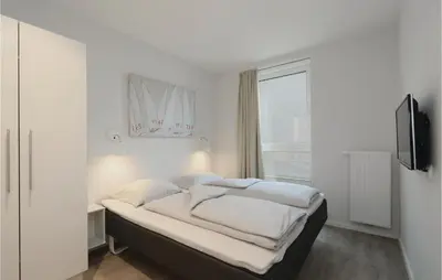 Ein Bett oder Betten in einem Zimmer der Unterkunft Priwallpromenade 1, Whg 4